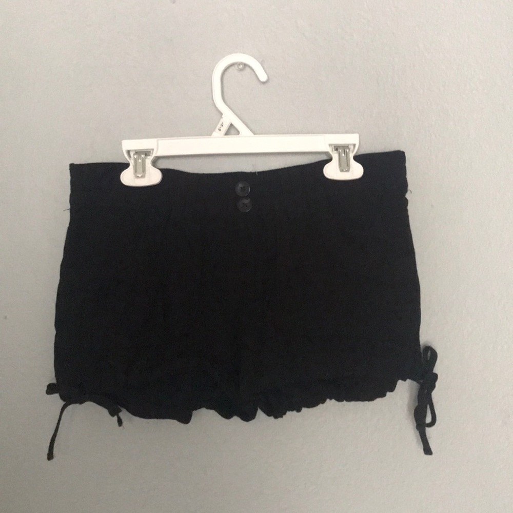 black stretchy shorts with ties on bottom